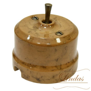 Выключатель керамика тумблерный 1 кл. проходной, капучино с бронзовой ручкой Lindas 34530-B